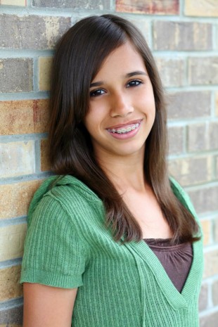 Smiling teenager with braces to represent orthodontics in Totowa NJ